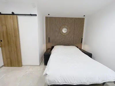 Un ou plusieurs lits dans un hébergement de l'établissement Studio Cosy Viel Antibes