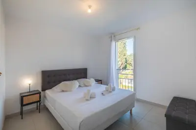 Un ou plusieurs lits dans un hébergement de l'établissement Appartement Azzuro - Welkeys