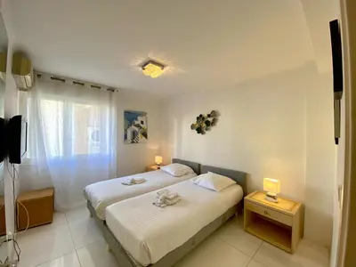 Un ou plusieurs lits dans un hébergement de l'établissement Spacieux 3 chambres BALCON, MARTINEZ -CARLTON A3B130