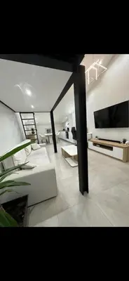 Télévision ou salle de divertissement dans l'établissement Le Baptiste