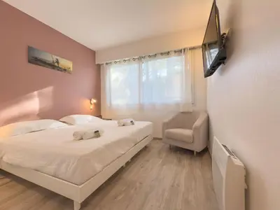 Un ou plusieurs lits dans un hébergement de l'établissement Le Cozy by Winsome Destination