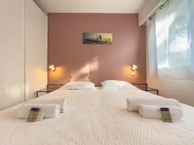 Un ou plusieurs lits dans un hébergement de l'établissement Le Cozy by Winsome Destination