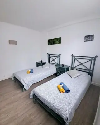 Un ou plusieurs lits dans un hébergement de l'établissement 4 - Person Apartment with Sea View terrace