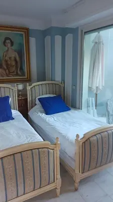 Un ou plusieurs lits dans un hébergement de l'établissement Appartement jardin