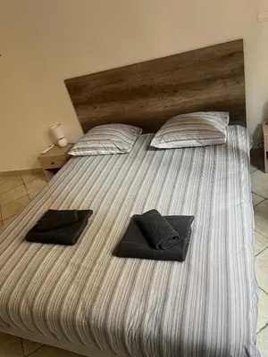 Un ou plusieurs lits dans un hébergement de l'établissement 2 rooms, old town