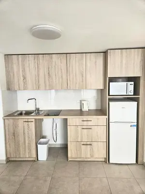 Cuisine ou kitchenette dans l'établissement Zenao Appart'hôtels Villeneuve Loubet