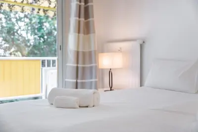 Un ou plusieurs lits dans un hébergement de l'établissement 3 pièces au calme avec terrasses et verdure