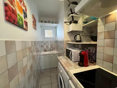 Cuisine ou kitchenette dans l'établissement L'helios studio au calme centre et mer