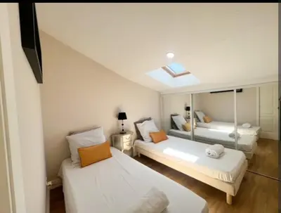 Un ou plusieurs lits dans un hébergement de l'établissement Appartement, proche du palais des festivals, plage et commerces