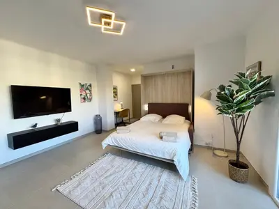 Télévision ou salle de divertissement dans l'établissement Le studio Prestige et Chic