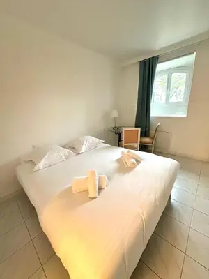 Un ou plusieurs lits dans un hébergement de l'établissement Appartement Spacieux dans une résidence Haut Standing