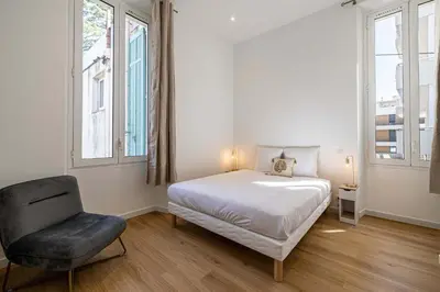 Un ou plusieurs lits dans un hébergement de l'établissement LE COSY un havre de paix près de la Croisette