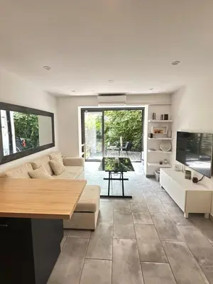 Télévision ou salle de divertissement dans l'établissement App 4 pers avec terrasse