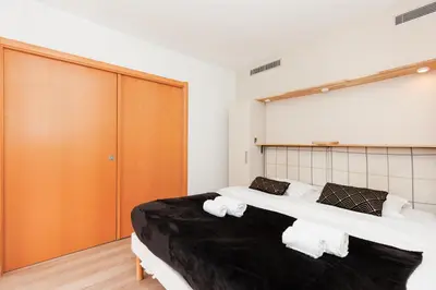 Un ou plusieurs lits dans un hébergement de l'établissement Pavillon Riviera YourHostHelper