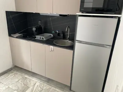 Cuisine ou kitchenette dans l'établissement Studio 100m plage