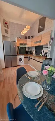 Cuisine ou kitchenette dans l'établissement Centre Carré d'or 3 chambres