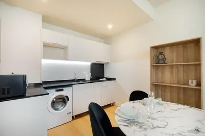 Cuisine ou kitchenette dans l'établissement Appartement Place de Gaulle - Welkeys