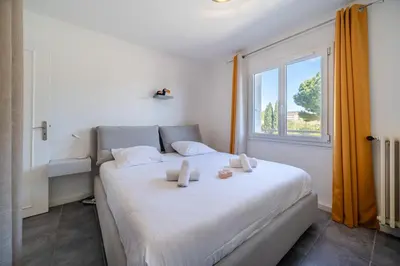 Un ou plusieurs lits dans un hébergement de l'établissement Appartement Rochat - Welkeys