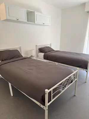 Un ou plusieurs lits dans un hébergement de l'établissement 2 pièces à 2 pas de la plage