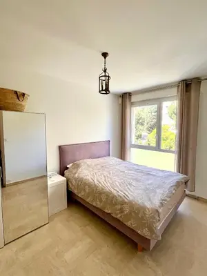 Un ou plusieurs lits dans un hébergement de l'établissement Charming Flat close to beach