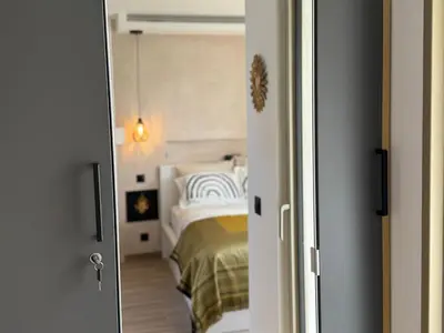 Un ou plusieurs lits dans un hébergement de l'établissement Romance Marine , face à la mer