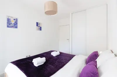 Un ou plusieurs lits dans un hébergement de l'établissement Cannes Maria YourHostHelper