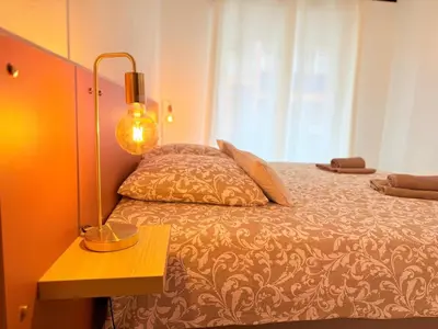 Un ou plusieurs lits dans un hébergement de l'établissement Les 3 Îles Appartement 2 pièces climatisé à 50 m des plages