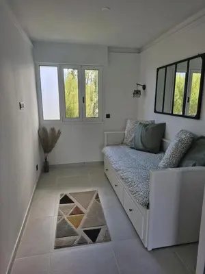 Coin salon dans l'établissement Appartement vu mer et montagnes