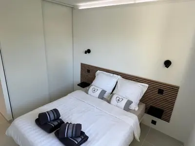 Un ou plusieurs lits dans un hébergement de l'établissement Appartement vu mer et montagnes