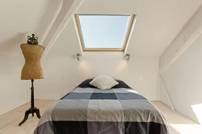 Un ou plusieurs lits dans un hébergement de l'établissement Aura Apartments by Halldis