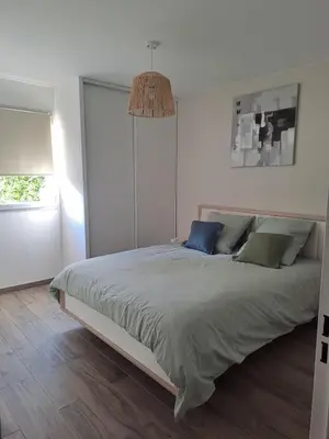 Un ou plusieurs lits dans un hébergement de l'établissement Appartement spacieux
