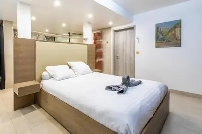 Un ou plusieurs lits dans un hébergement de l'établissement Appartement en bord de mer avec piscine - Cannes