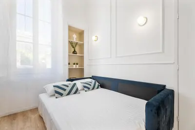 Un ou plusieurs lits dans un hébergement de l'établissement Appartement Prado - Welkeys