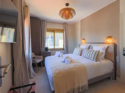Un ou plusieurs lits dans un hébergement de l'établissement Hôtel Lou Juan