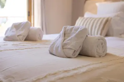 Un ou plusieurs lits dans un hébergement de l'établissement Hôtel Lou Juan