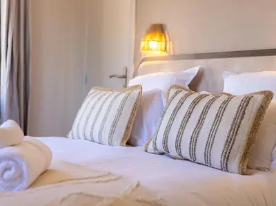 Un ou plusieurs lits dans un hébergement de l'établissement Hôtel Lou Juan