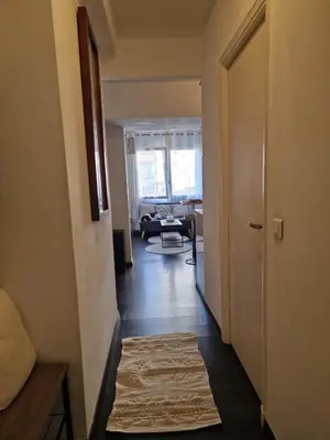Coin salon dans l'établissement Bright apartment 10 minutes from Cannes