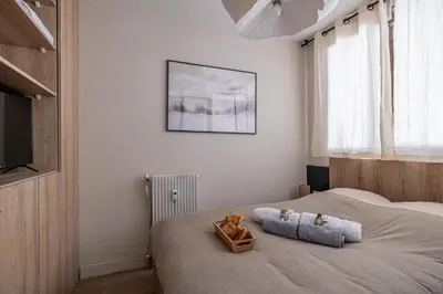 Un ou plusieurs lits dans un hébergement de l'établissement Super appartement centre Juan les Pins proche mer