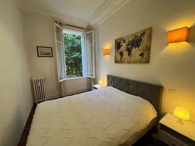 Un ou plusieurs lits dans un hébergement de l'établissement Beau 2 pièces, art déco, plein centre