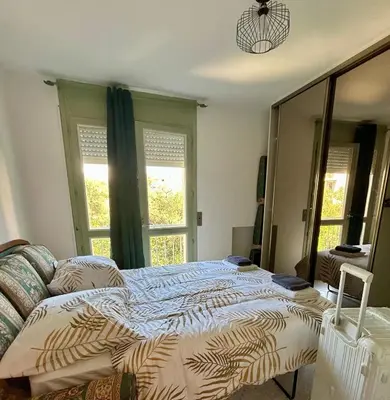 Un ou plusieurs lits dans un hébergement de l'établissement appartement 3 pieces 2 chambres centre ville