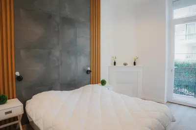 Un ou plusieurs lits dans un hébergement de l'établissement Cozy Home Cannes