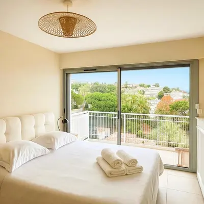 Un ou plusieurs lits dans un hébergement de l'établissement Apartment Center of Cannes