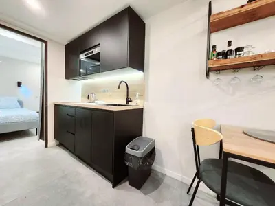Un ou plusieurs lits dans un hébergement de l'établissement La Fourmi Azuréenne - Studio dans le Vieil Antibes