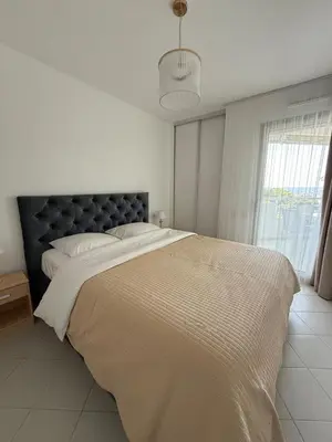 Un ou plusieurs lits dans un hébergement de l'établissement Appartements en bord de mer