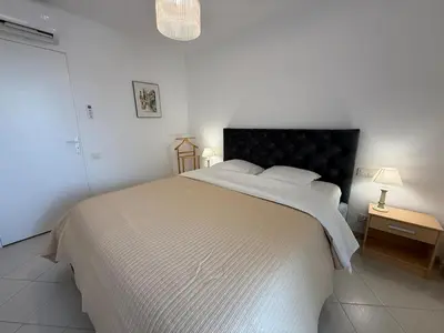 Un ou plusieurs lits dans un hébergement de l'établissement Appartements en bord de mer