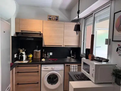 Cuisine ou kitchenette dans l'établissement Le Nid Douillet du Carré d'OR