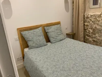 Un ou plusieurs lits dans un hébergement de l'établissement appartement avec patio vielle Antibes