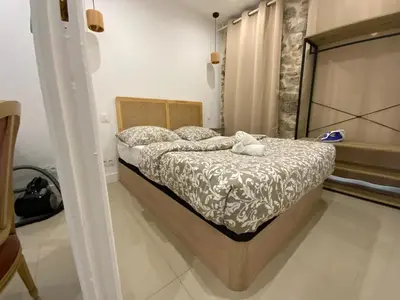 Un ou plusieurs lits dans un hébergement de l'établissement appartement avec patio vielle Antibes