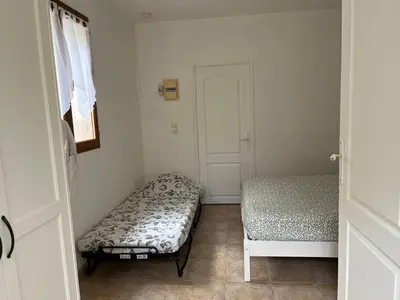 Un ou plusieurs lits dans un hébergement de l'établissement La Cigalière - Appartement Rez-de-Jardin