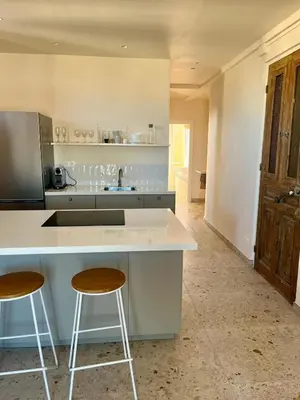 Cuisine ou kitchenette dans l'établissement Bel appartement près de la plage
